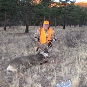 My old hunting buddy with the last successful hunt he had before he passed away in 2013. It was my honor to help him bag this Muley.